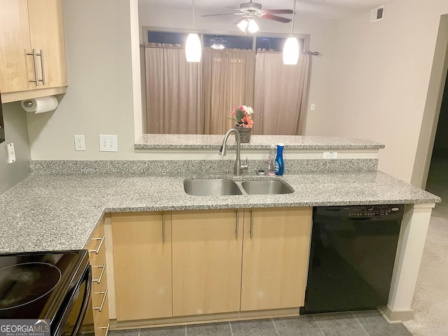 kitchen featuring light stone counters, sink, light brown cabinets, black dishwasher, and hanging light fixtures