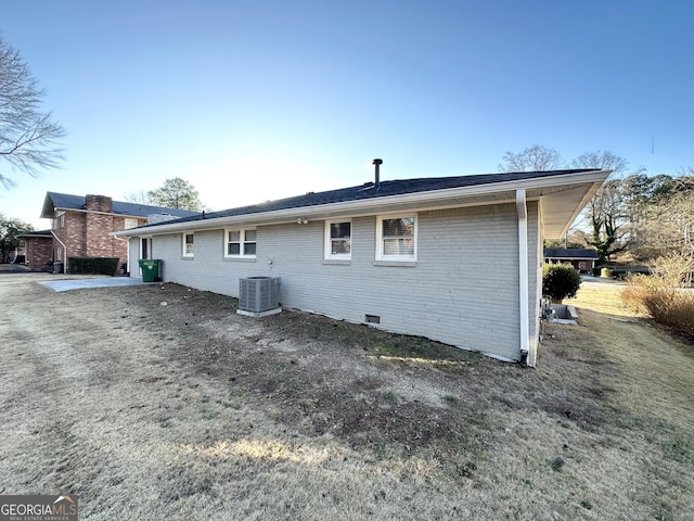 back of house featuring central AC