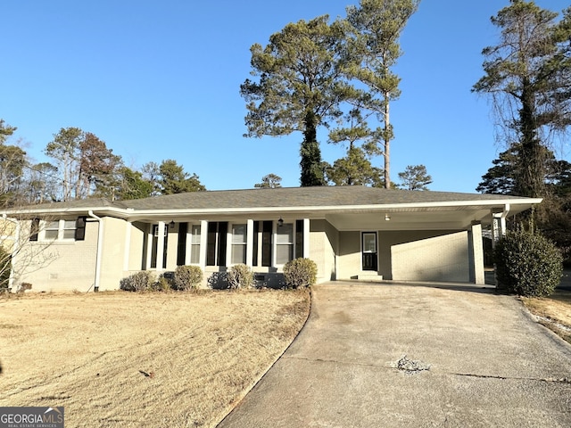 ranch-style house featuring a carport