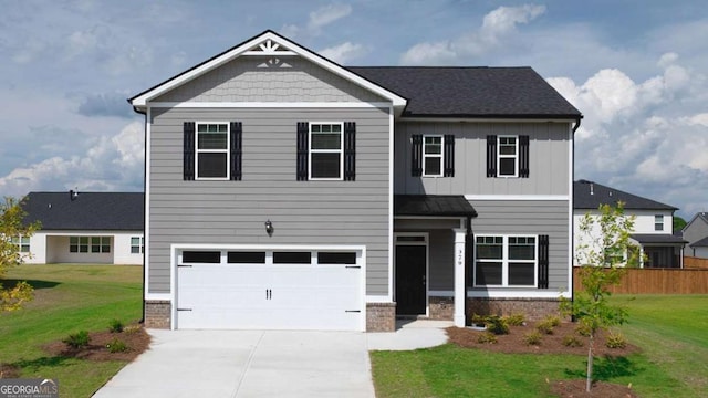 view of front of house with a garage and a front yard