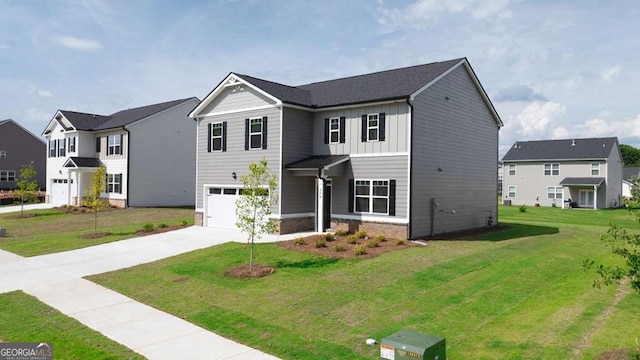 view of front of property with a garage and a front yard