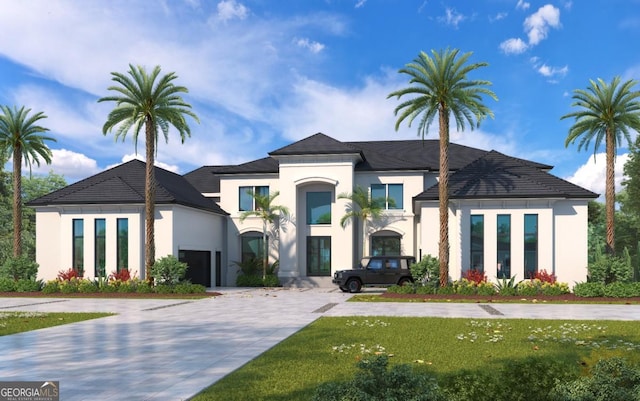 view of front of house with a garage and a front yard