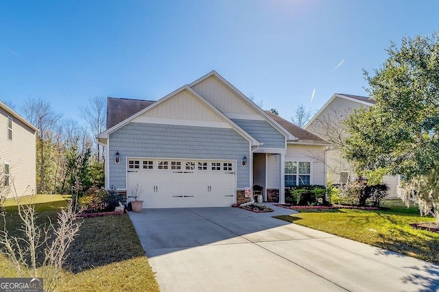 view of front of house featuring a garage and a front lawn