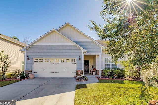 craftsman-style house with a garage and a front lawn