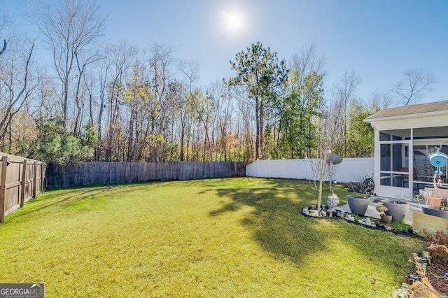 view of yard featuring a sunroom