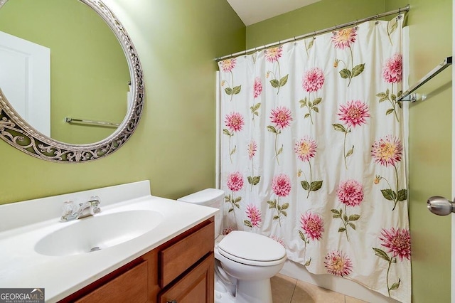 bathroom featuring tile patterned floors, curtained shower, vanity, and toilet