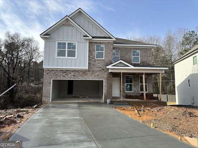 view of front of home with a porch and a garage