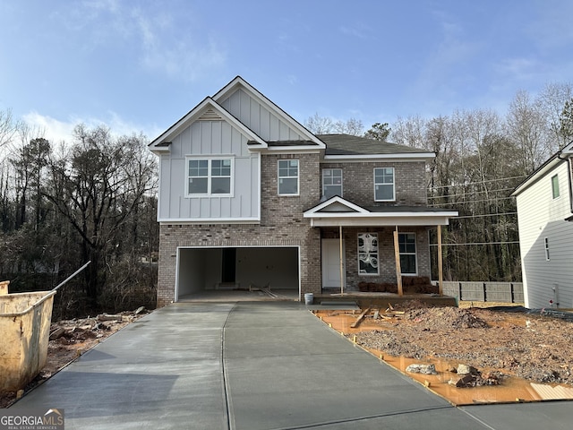 view of front of property featuring a porch and a garage