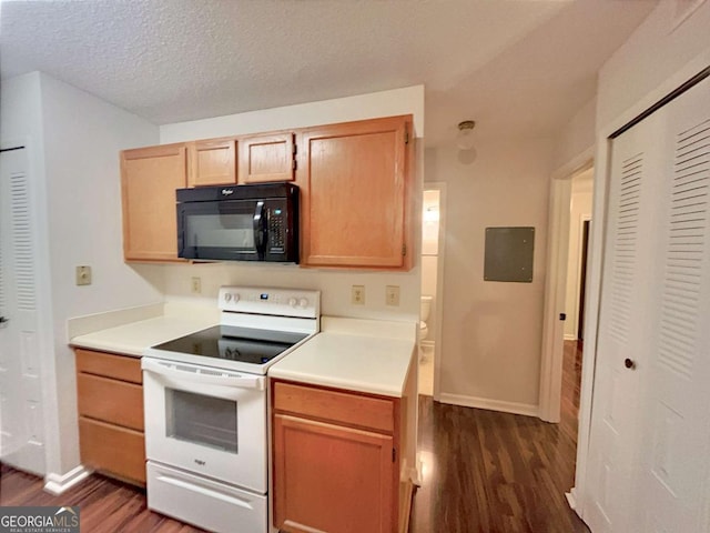 kitchen featuring electric stove, dark wood-type flooring, and a textured ceiling