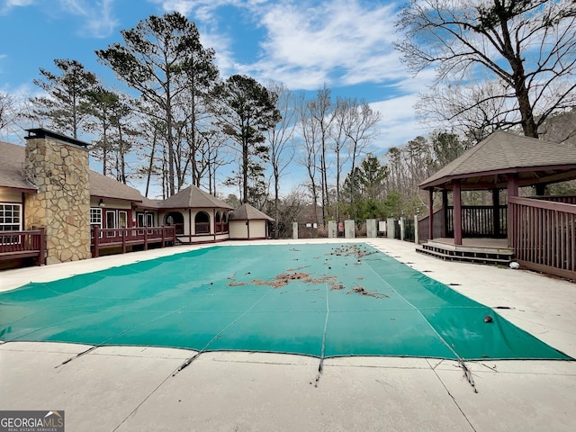 view of swimming pool featuring a gazebo and a patio area