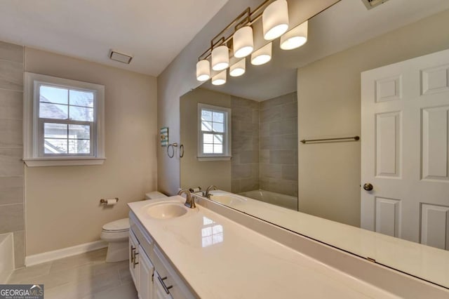 bathroom featuring toilet, tile patterned flooring, and vanity