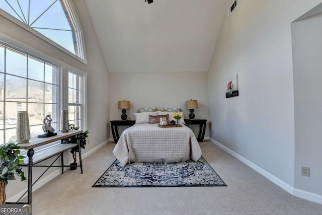 carpeted bedroom featuring a towering ceiling