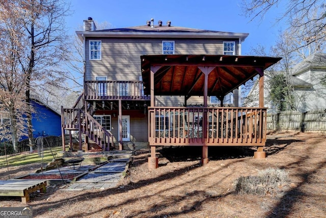 rear view of house featuring a deck