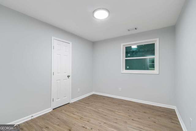 unfurnished room featuring light wood-type flooring