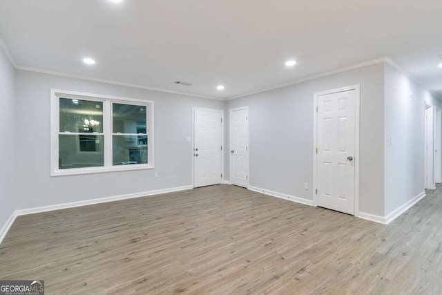 unfurnished room with light hardwood / wood-style floors and ornamental molding