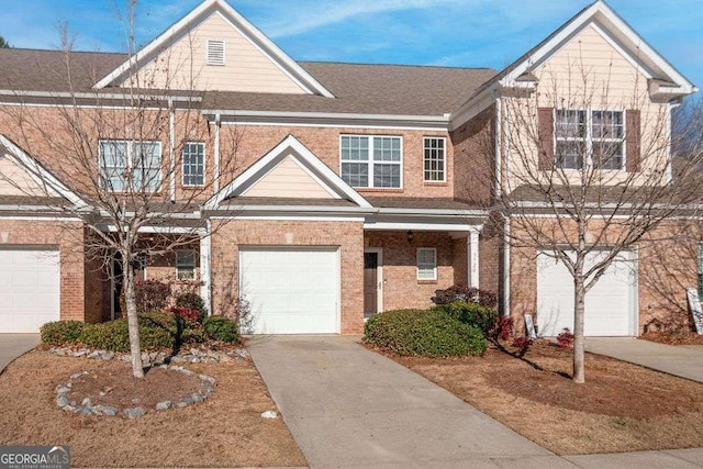 townhome / multi-family property featuring a garage