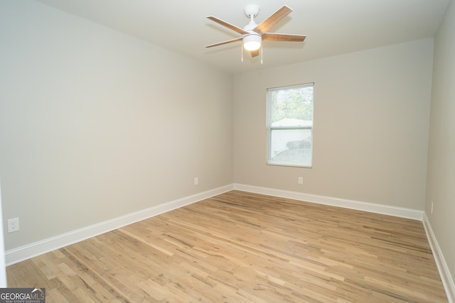 empty room featuring ceiling fan and light hardwood / wood-style floors