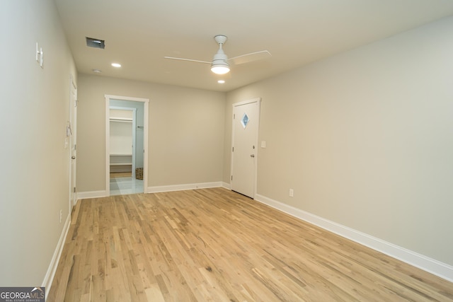 spare room with ceiling fan and light hardwood / wood-style flooring