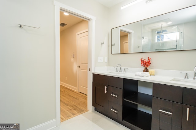 bathroom with vanity and hardwood / wood-style flooring