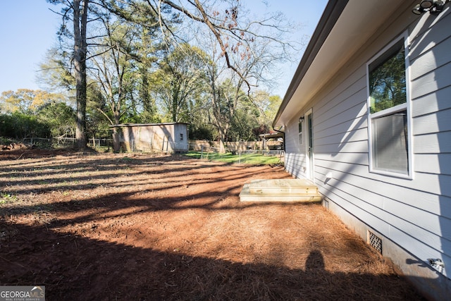 view of yard featuring a storage shed