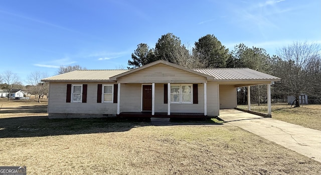 ranch-style house with a front yard and a carport