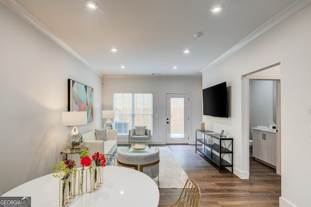 living room featuring crown molding and dark hardwood / wood-style floors