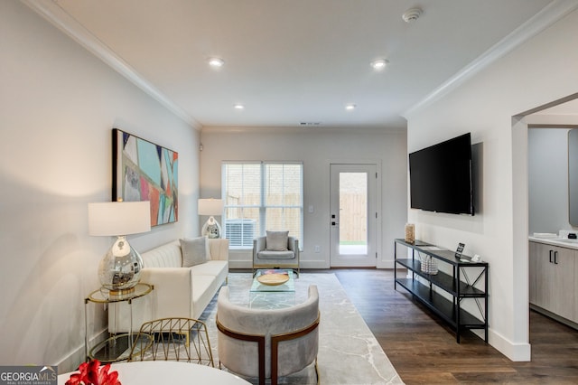 living room with ornamental molding and dark hardwood / wood-style floors