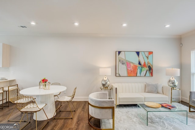 living room with dark wood-type flooring and crown molding