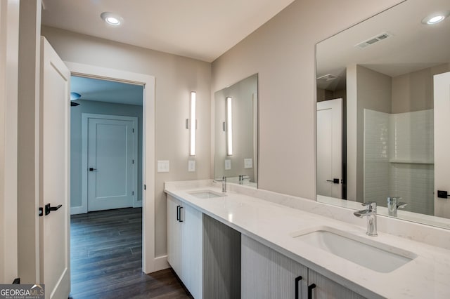 bathroom featuring vanity and hardwood / wood-style floors