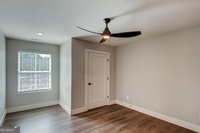 unfurnished room featuring hardwood / wood-style floors and ceiling fan