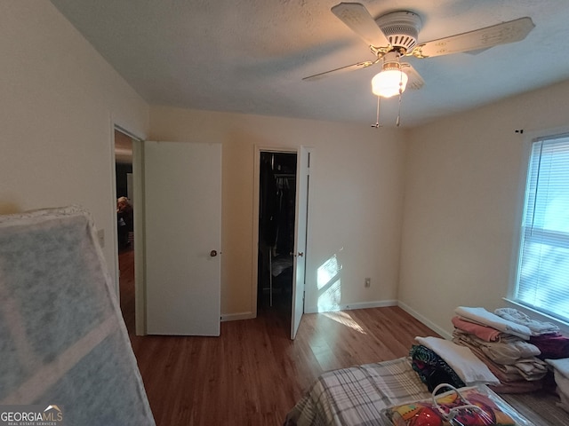 bedroom with hardwood / wood-style flooring and ceiling fan