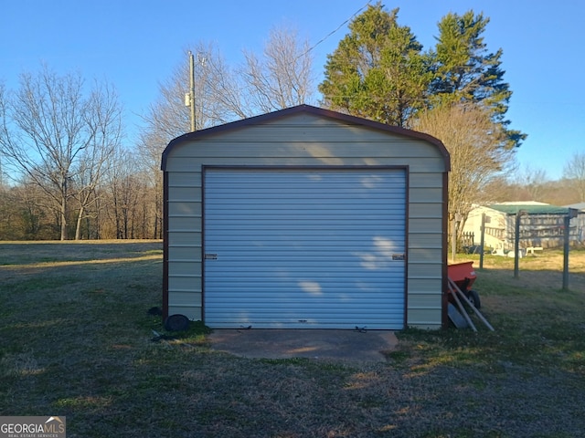 garage with a lawn