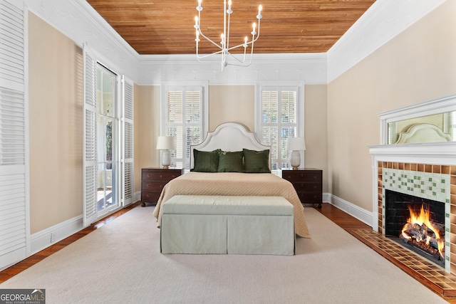 bedroom featuring access to exterior, a fireplace, wood ceiling, and hardwood / wood-style flooring