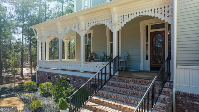 entrance to property featuring covered porch