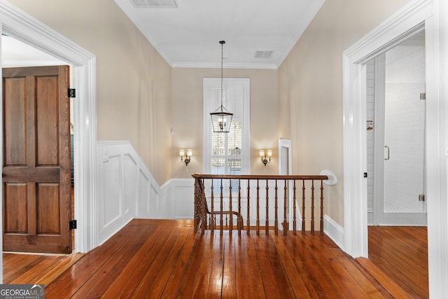 hall with crown molding and dark wood-type flooring