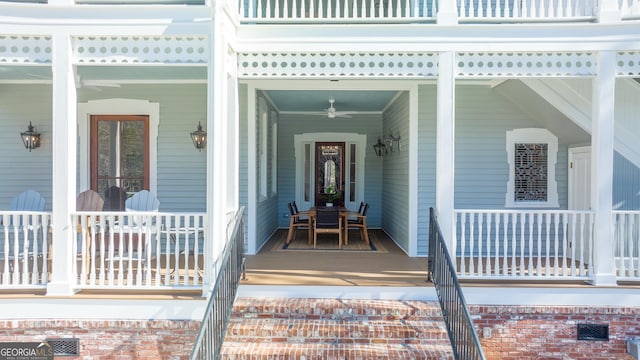 doorway to property featuring ceiling fan and covered porch