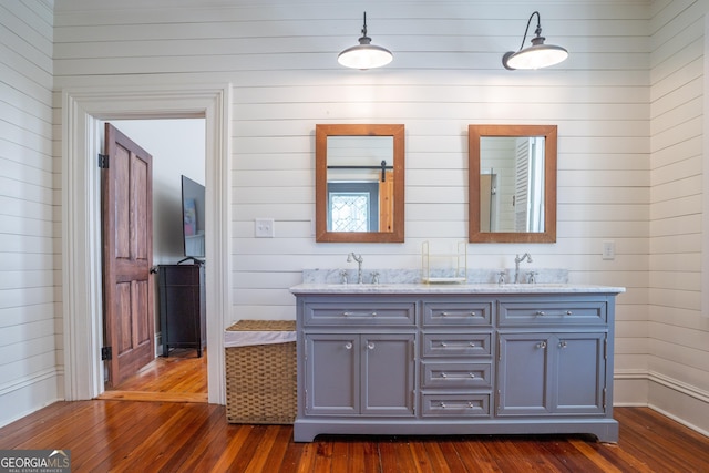 bathroom with hardwood / wood-style floors and vanity