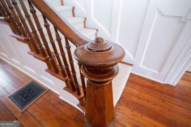 staircase featuring hardwood / wood-style floors