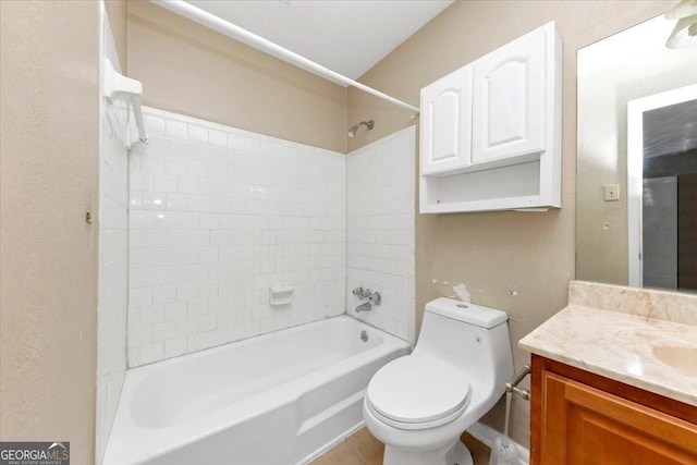 full bathroom with vanity, toilet, and tiled shower / bath