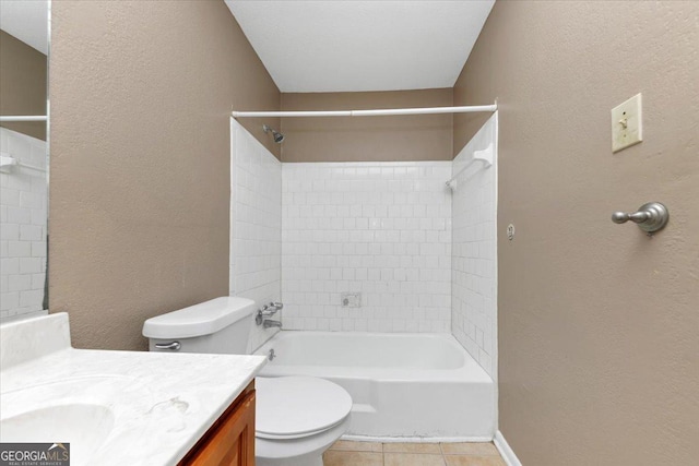 full bathroom featuring toilet, vanity, tile patterned floors, and tiled shower / bath combo