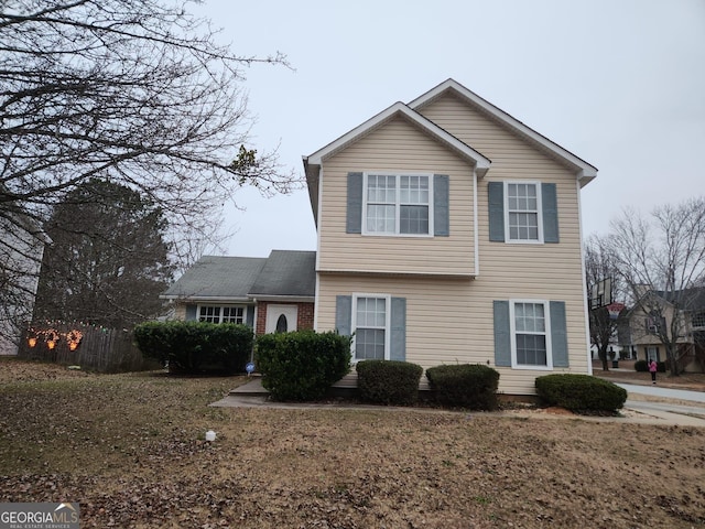 front facade with a front lawn