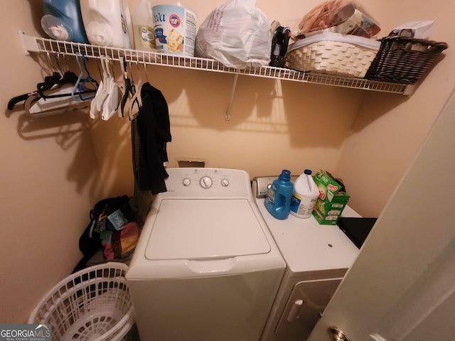 laundry area with washer and clothes dryer