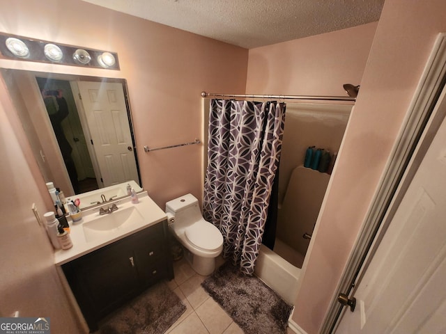 full bathroom with vanity, tile patterned floors, toilet, a textured ceiling, and shower / tub combo