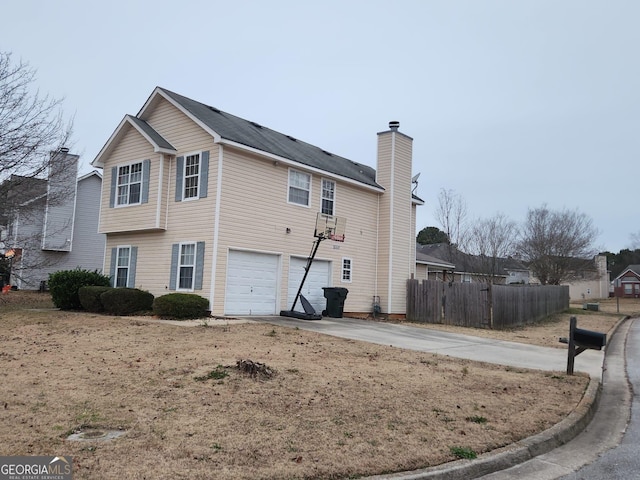 rear view of property with a garage