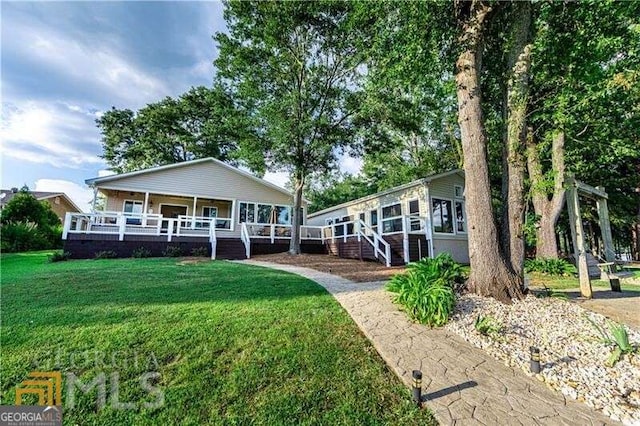 view of front of home with a front lawn and a porch