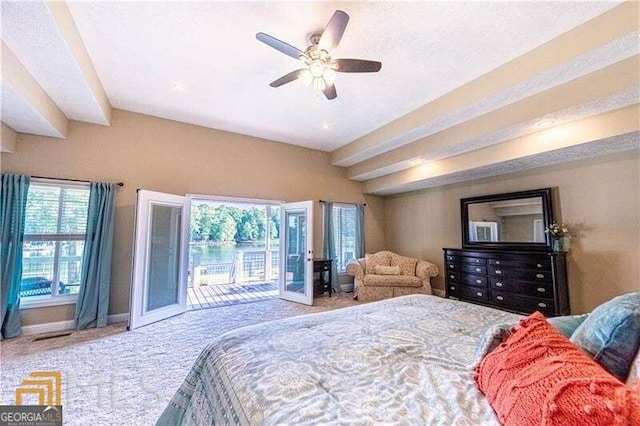 carpeted bedroom featuring access to exterior and ceiling fan