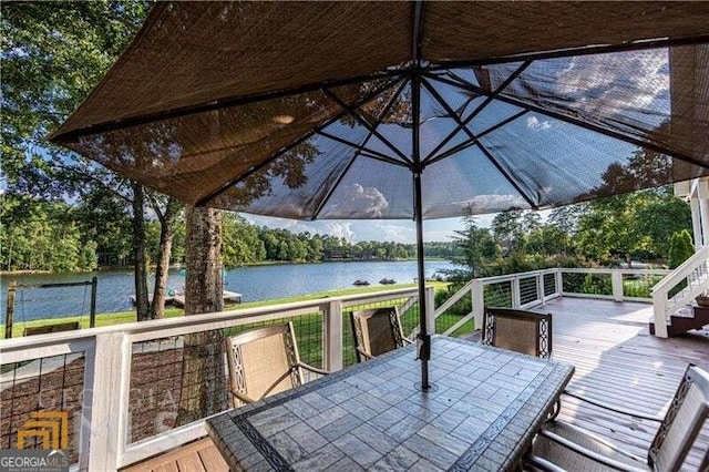 wooden deck featuring a water view