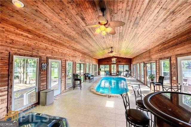 view of pool featuring ceiling fan and an indoor hot tub