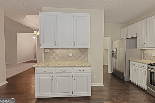 kitchen featuring dark hardwood / wood-style flooring, white cabinetry, and stainless steel appliances