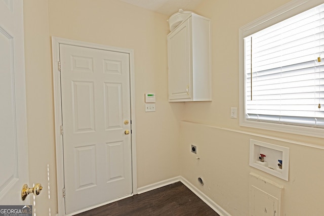 laundry area featuring cabinets, hookup for a washing machine, dark hardwood / wood-style floors, and electric dryer hookup